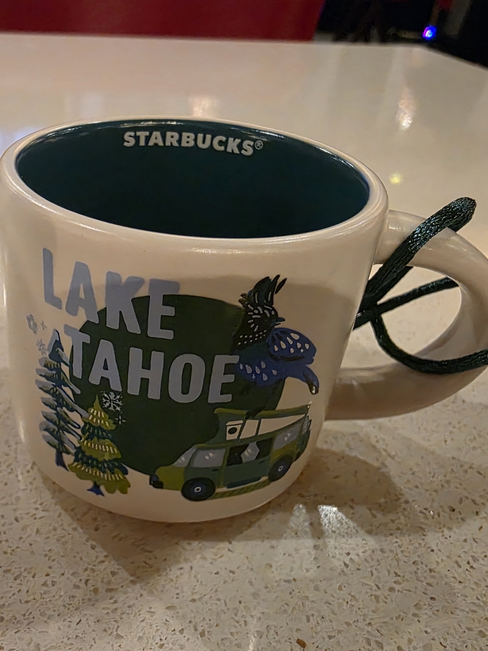 Starbucks Lake Tahoe Cream Mug with Green Interior and Blue Accents